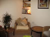 Living Room Chair with Bookcase in Corner